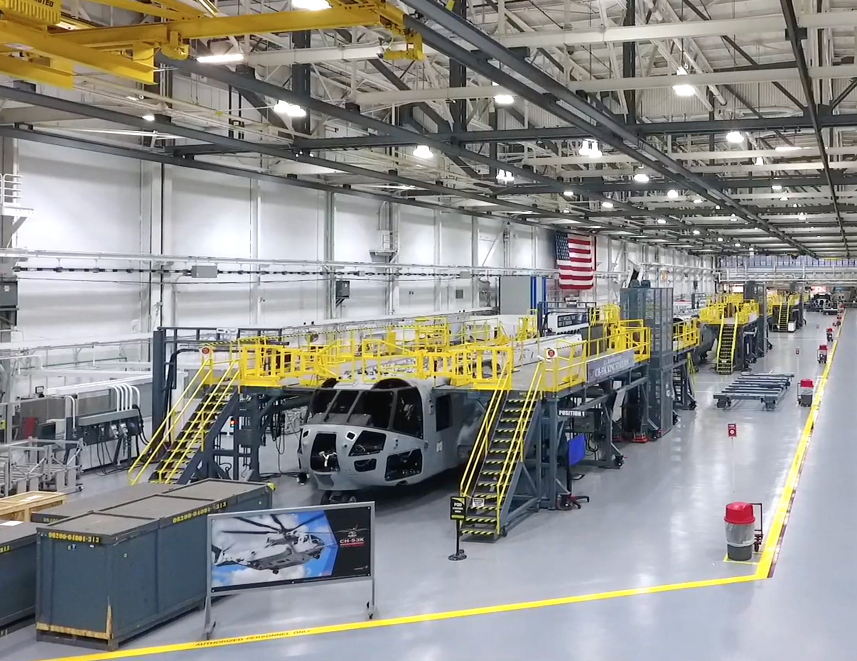 Defense manufacturing assembly line with helicopters in production